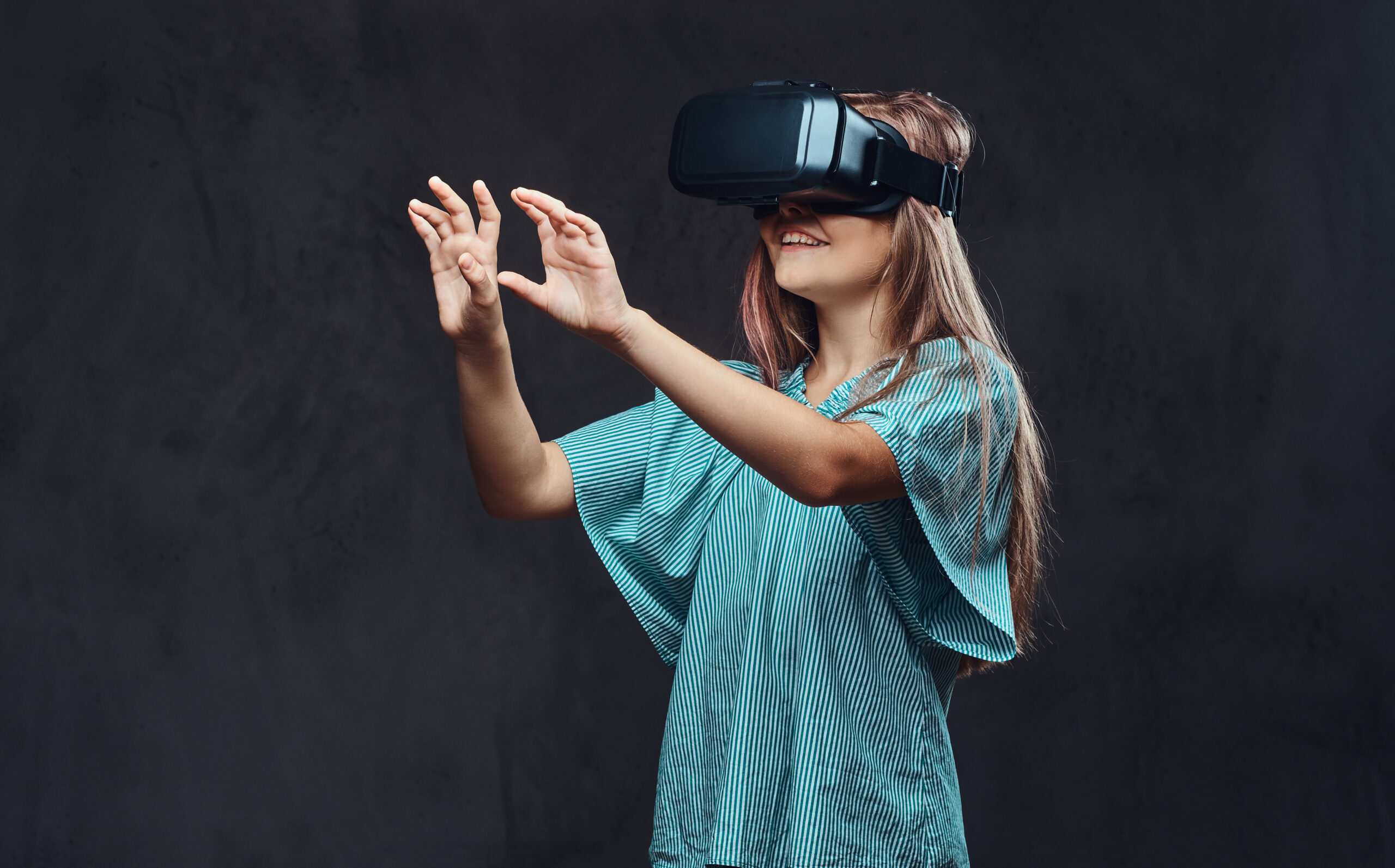 Young girl dressed casual using virtual reality glasses