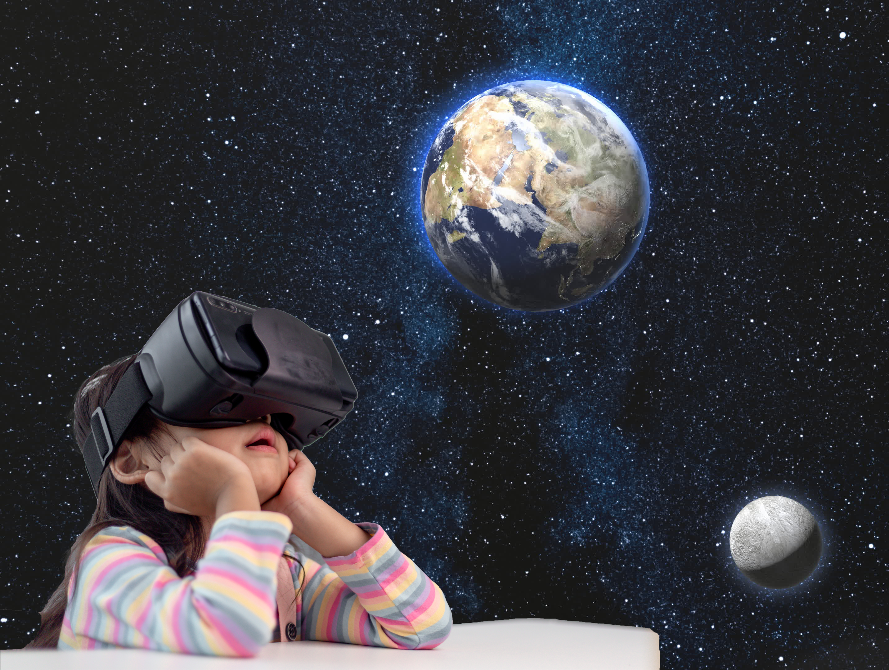Girl using virtual reality glasses looking at the Earth and Moon